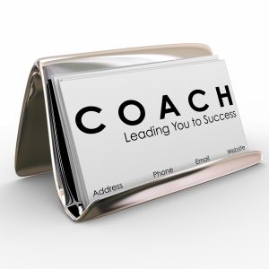 Coach word and Leading you to Success on a business card to advertise or promote your services as a leader, motivator, trainer, mentor or instructor for a team of athletes or business people